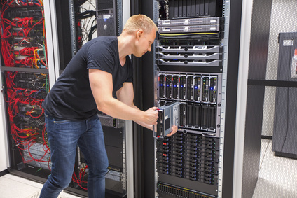 Computer Engineer Installing Blade Server In Datacenter